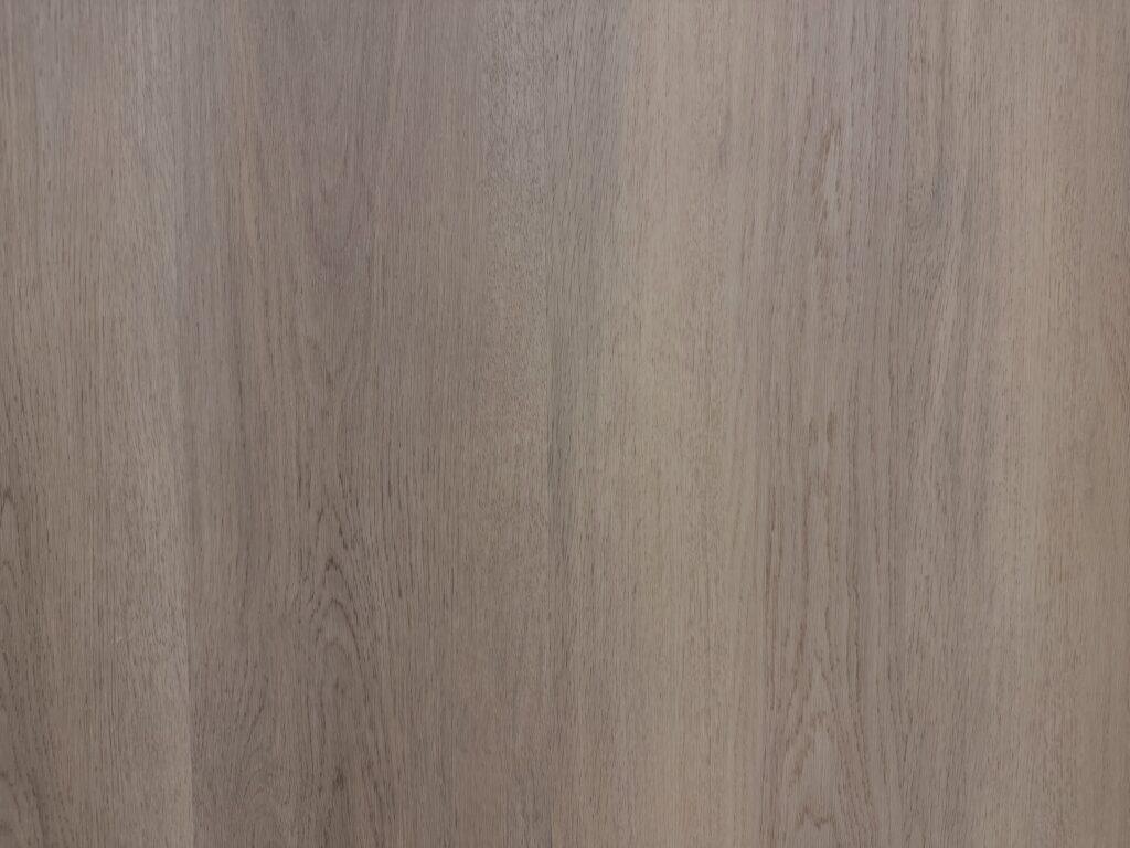 Luxury vinyl plank flooring sample showing color and surface texture